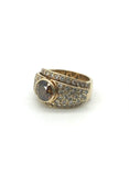 Opulenter Goldring mit zentralem cognacfarbenem Brillant
